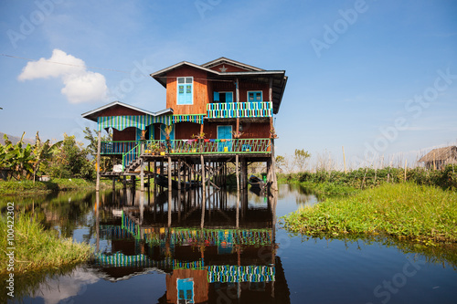 House and floating gardens at one of Inle Lake villages on the water in Myanmar. photo