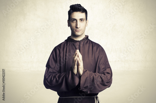 Fototapeta young friar praying