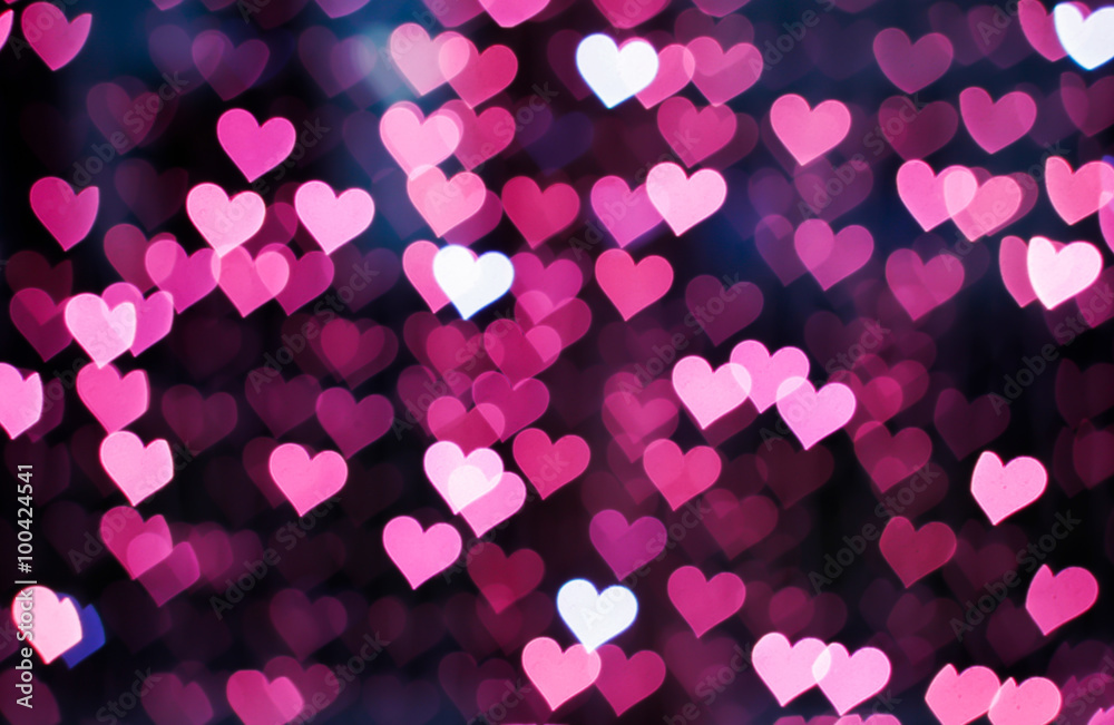 Blurring lights bokeh background of pink hearts