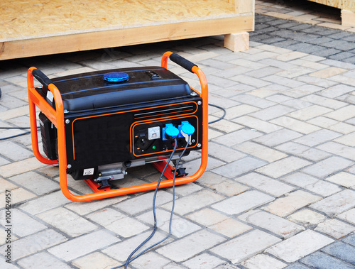 Mobile Gasoline Generator on the Building Site photo