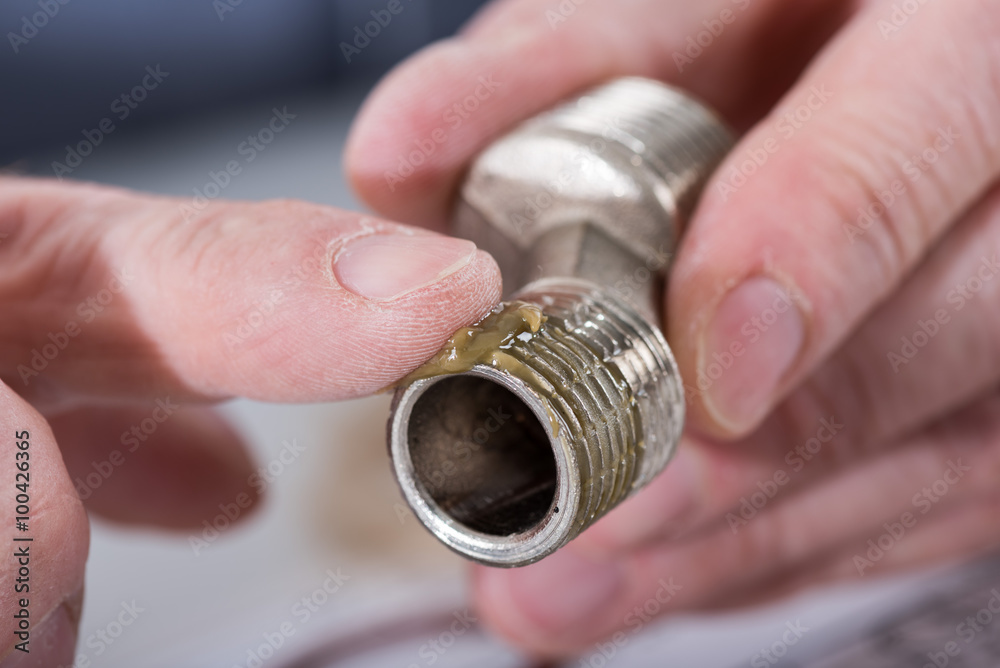 Plumber putting sealing paste on a thread Stock Photo Adobe Stock