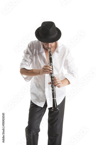 man in hat playing clarinet
