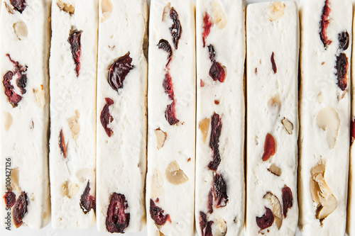 Nougat with fruit and nuts background