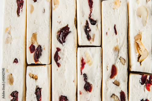 Nougat with fruit and nuts background horizontal