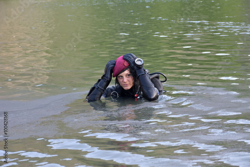 beautiful caucasian diver woman in the water