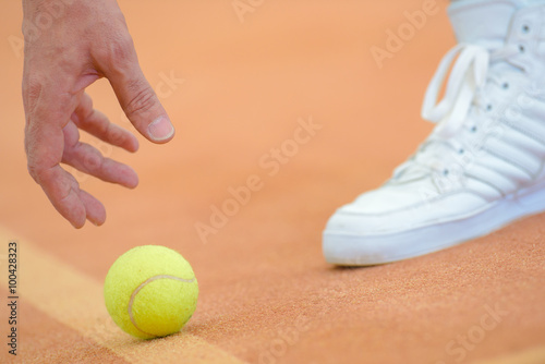 picking up tennis ball © auremar