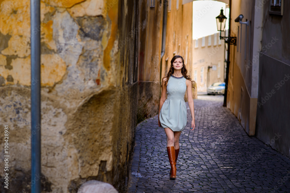 Smiling young long-haired Bohemian girl in Prague.