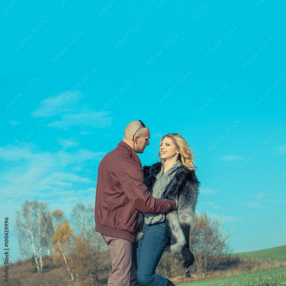 young beautiful couple having fun outdoors. Young happy couple outdoor portrait. Beautiful boy and girl have fun in the field. young beautiful couple having fun outdoors. Young happy couple outdoor portrait. Beautiful boy and girl have fun in the field.
