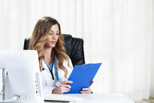 Female doctor with computer  photo