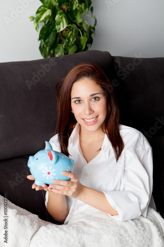 Young woman on her couch thinking about his future