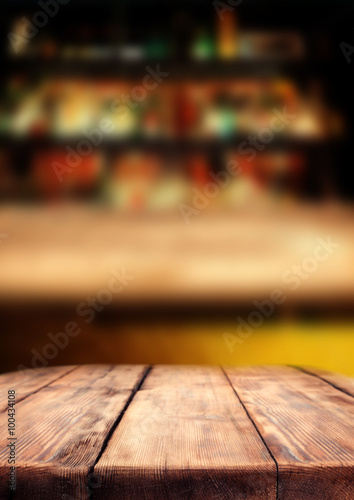 Wooden table in the pub bar, dark interior