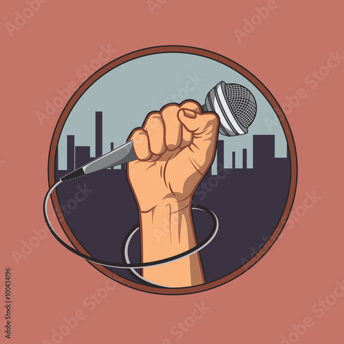 hand holding a microphone in a fist