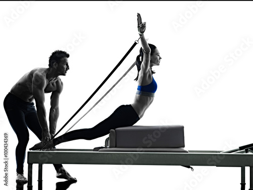 couple pilates reformer exercises fitness isolated photo
