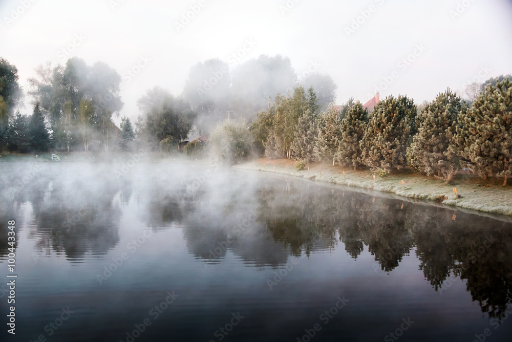 Mystical fog over the lake in the morning. Mystical fog over the lake in the morning.