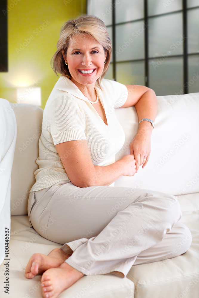 Senior woman relaxing in modern apartment. Senior woman relaxing in modern apartment.