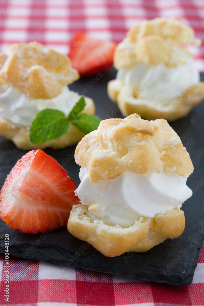 Profiteroles and strawberries on slate
Profiteroles and strawberries on slate