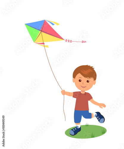 Cheerful boy enjoying flying kite. 