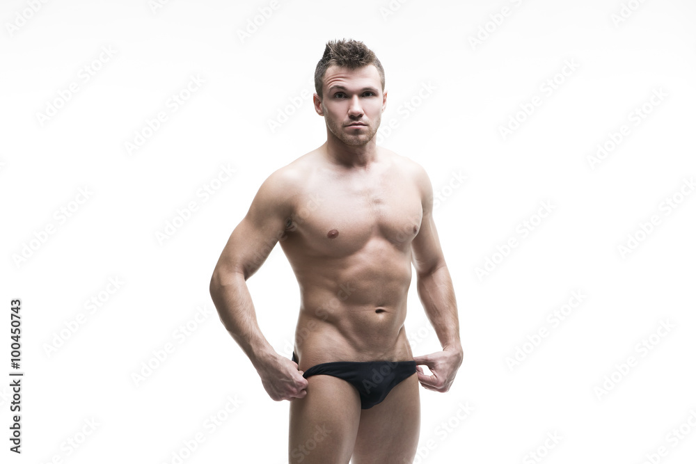 Handsome muscular bodybuilder posing on white background. Isolated studio shot Handsome muscular bodybuilder posing on white background. Isolated studio shot