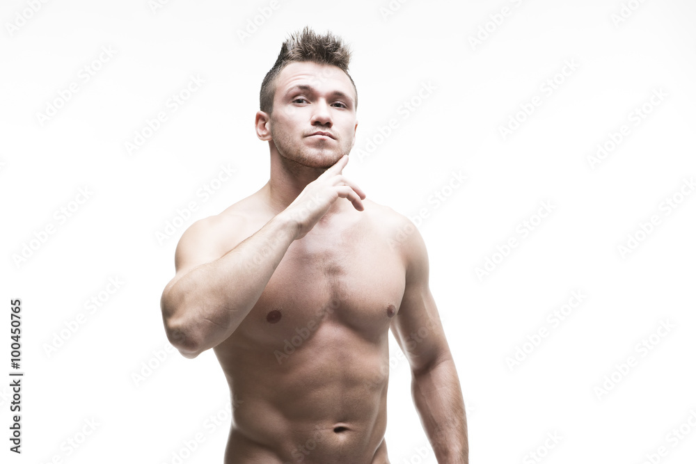 Fototapeta premium Handsome muscular bodybuilder posing on white background. Isolated studio shot