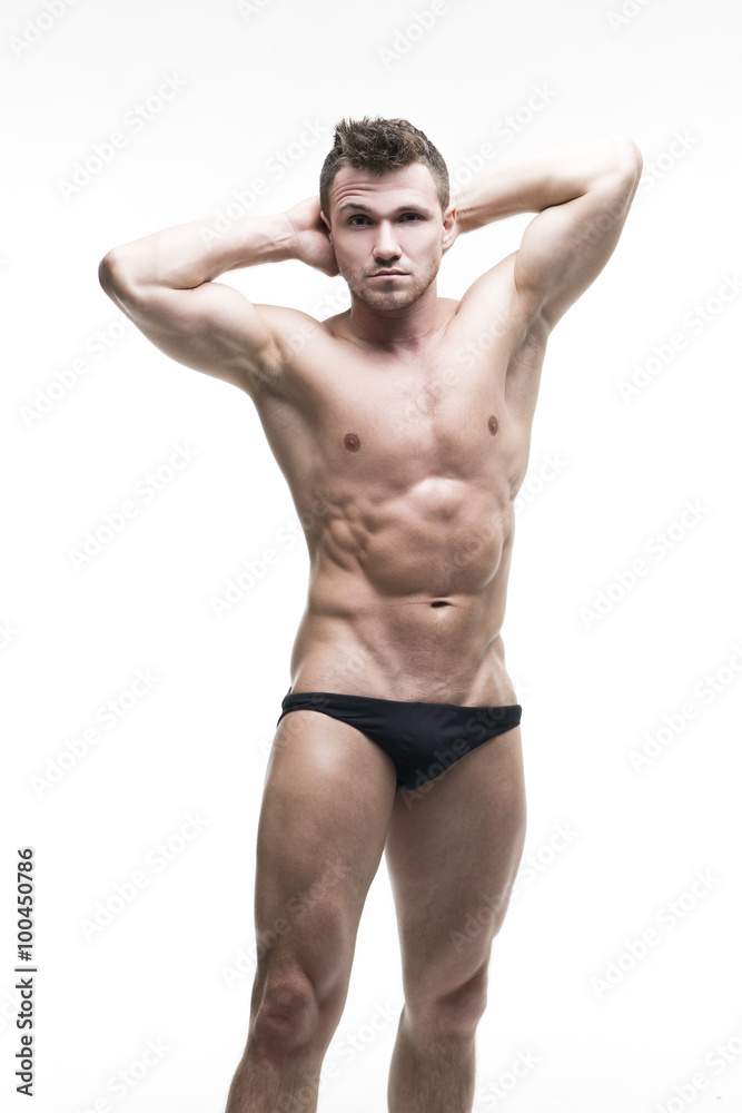 Handsome muscular bodybuilder posing on white background. Isolated studio shot Handsome muscular bodybuilder posing on white background. Isolated studio shot
