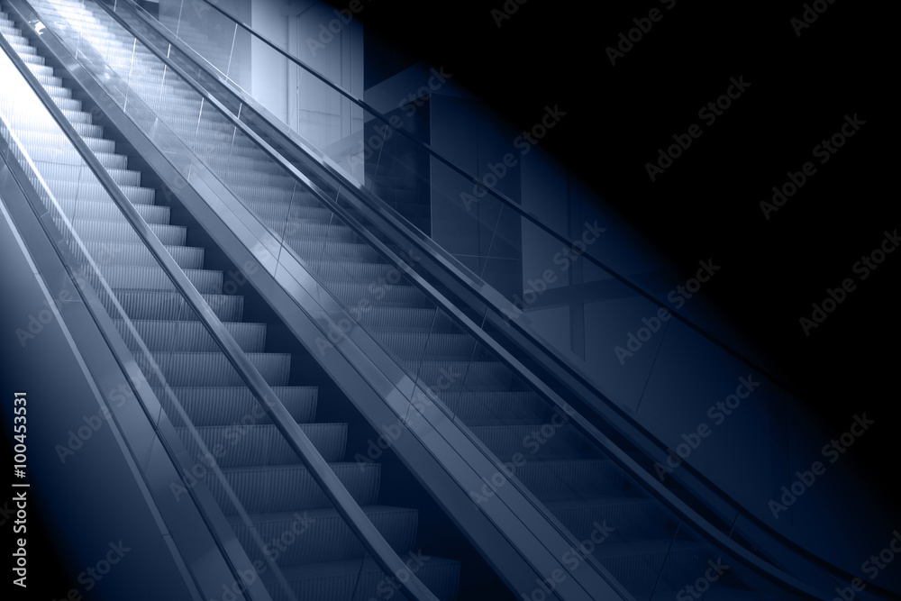concept background of escalator with the light at the end concept background of escalator with the light at the end