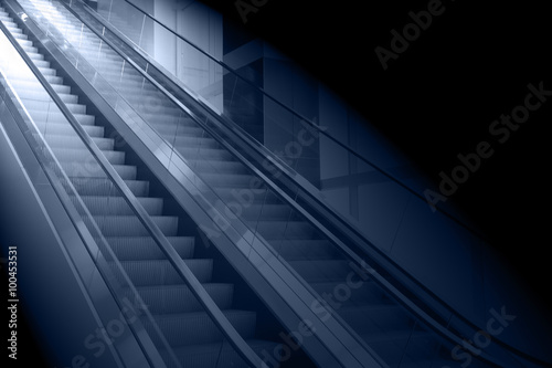 concept background of escalator with the light at the end
