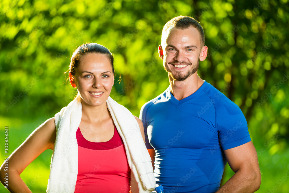 Obraz premium Athletic man and woman after fitness exercise
