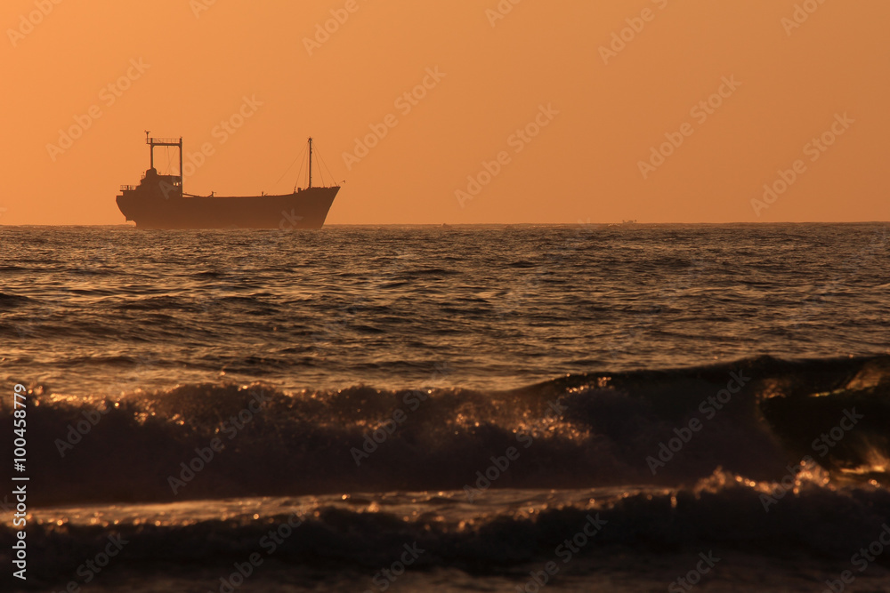 Silhouette of a ship at sunset. Mediterranean Sea. Cyprus. Silhouette of a ship at sunset. Mediterranean Sea. Cyprus.