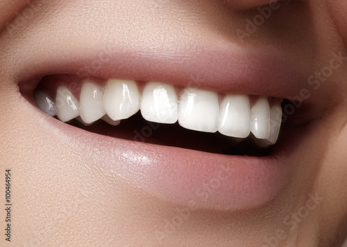 Beautiful smile with whitening teeth. Dental photo. Macro closeup of perfect female mouth  lipscare rutine