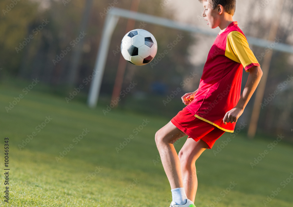 Naklejka premium Child playing football