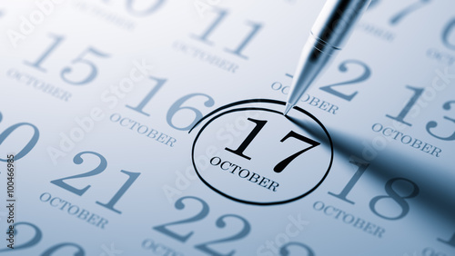 Fotografie October 17 written on a calendar to remind you an important appo