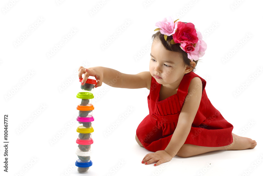 Cute little girl making from plasticine box, isolated on white background Cute little girl making from plasticine box, isolated on white background