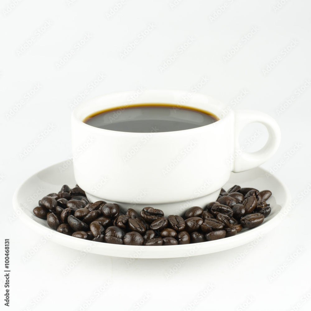 white cup with coffee beans, isolated on white background white cup with coffee beans, isolated on white background