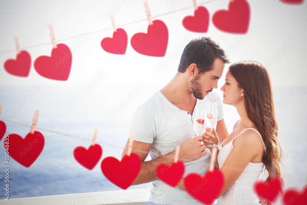 Composite image of cute couple toasting with champagne Composite image of cute couple toasting with champagne