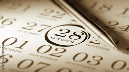 October 28 written on a calendar to remind you an important appo photo