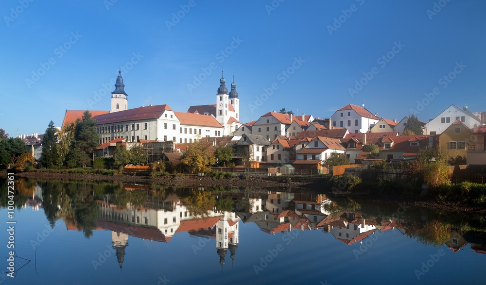 Morning view of Telc or Teltsch town mirroring in lake Morning view of Telc or Teltsch town mirroring in lake