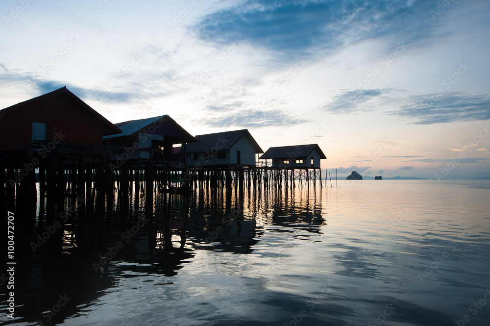 Ko Panyee muslim fishing village - Huts on stilts at sunrise Ko Panyee muslim fishing village - Huts on stilts at sunrise