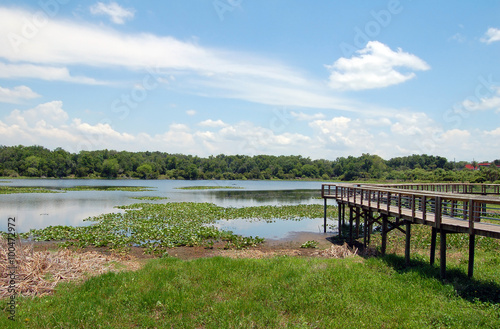 Texas wetlands with trial path and blue sky