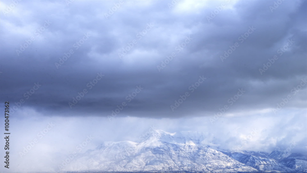 Time-lapse shot of snow-covered mountain tops in Utah