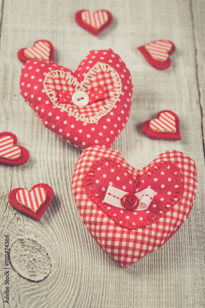 Two hearts hanging on wooden background Two hearts hanging on wooden background