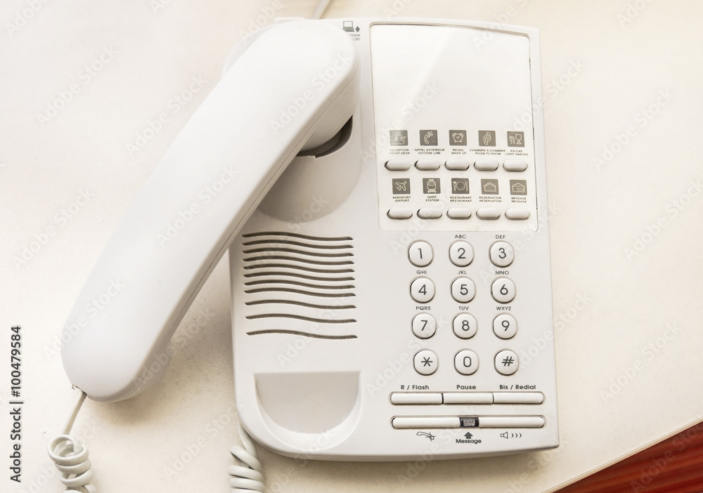 Telephone on desk in hotel room Telephone on desk in hotel room
