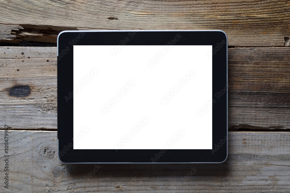 Black digital tablet on wooden table. View from above. Black digital tablet on wooden table. View from above.