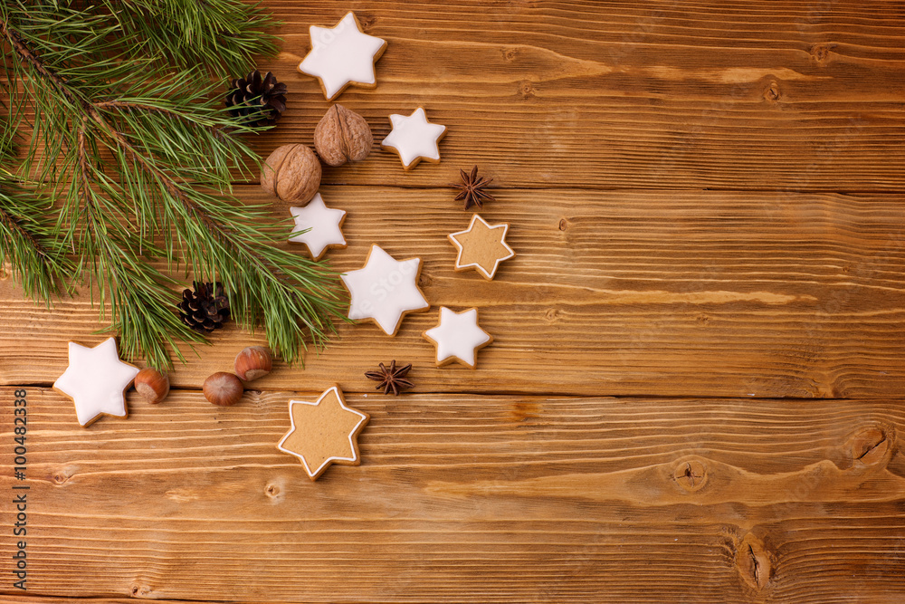 Background of ginger cookies and Christmas tree on a wooden table. Background of ginger cookies and Christmas tree on a wooden table.
