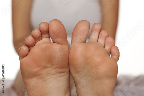 bare female feet on white
