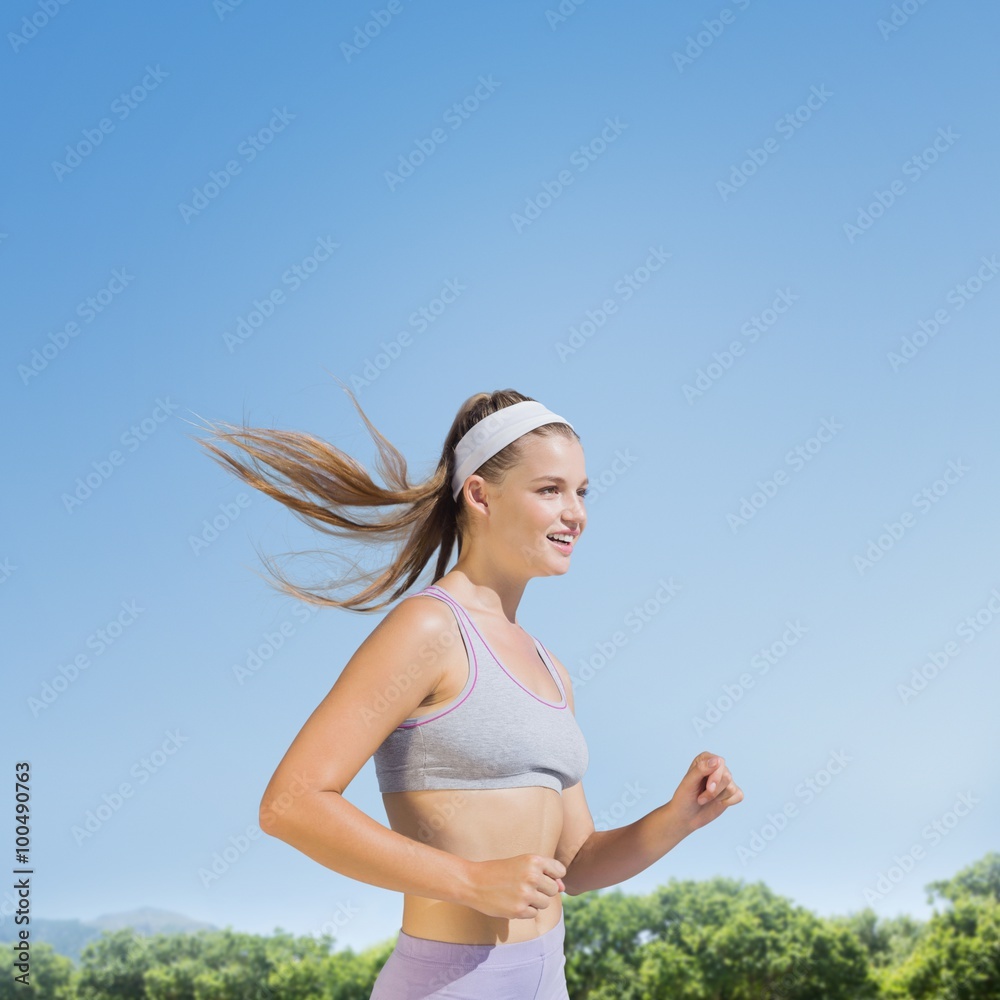 Composite image of sporty smiling blonde jogging Composite image of sporty smiling blonde jogging