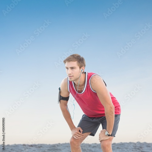 Composite image of fit man taking break