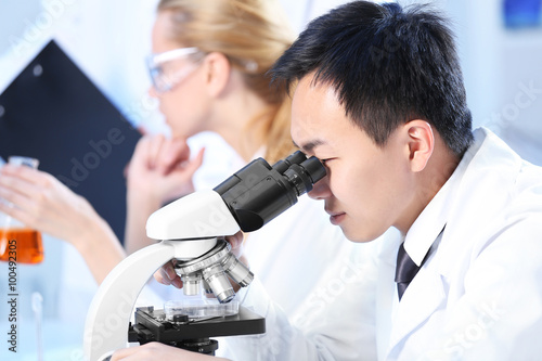 Young medical technicians working in laboratory