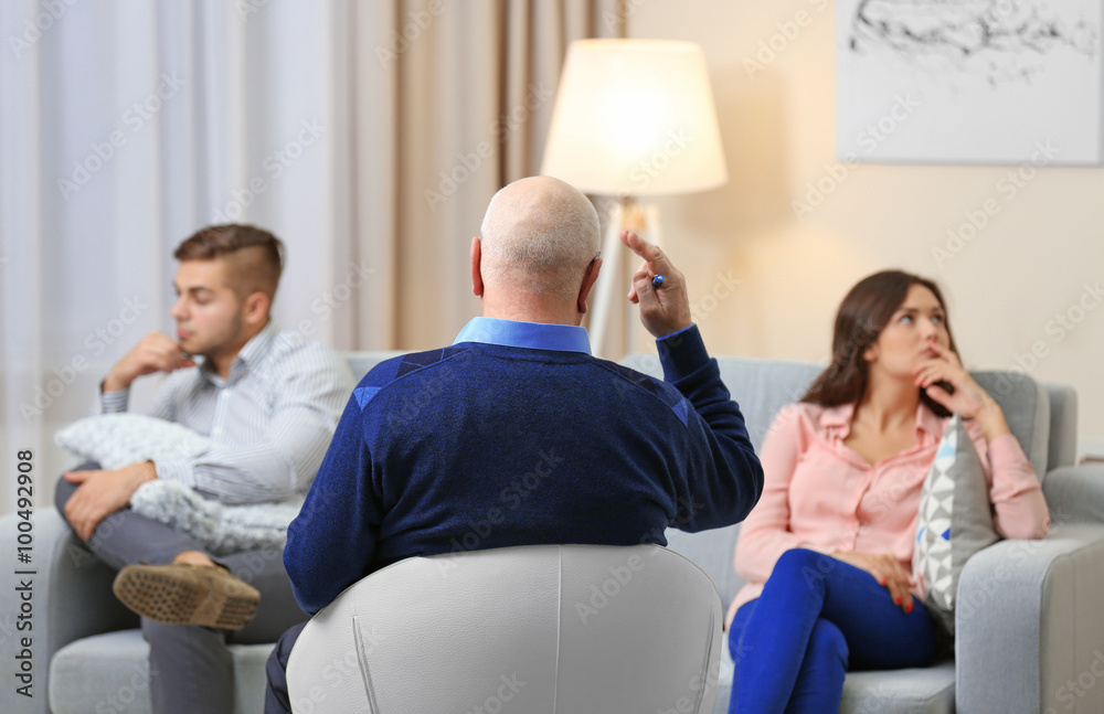 Young couple with problem on reception for family psychologist