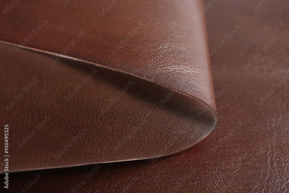 Brown-white leather front and wrong side texture, close-up Brown-white leather front and wrong side texture, close-up