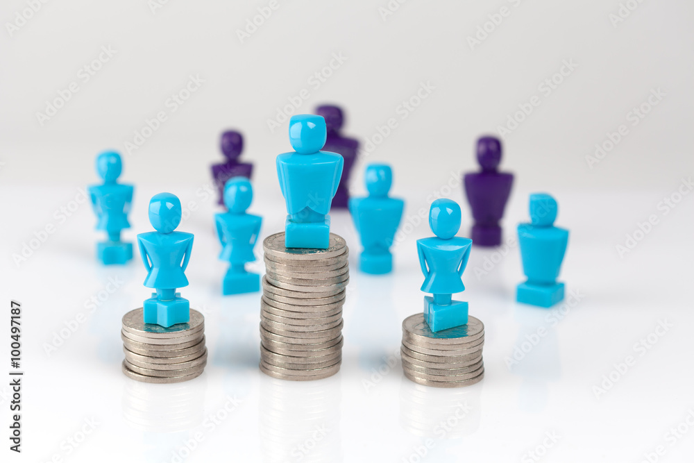 Male and female figurines standing on top of coin piles with oth Male and female figurines standing on top of coin piles with oth